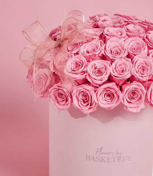 Lush pink rose bouquet from Flowers by Basketeer, presented in a round VIP box and tied with an elegant sheer ribbon. Perfect for flower delivery Bangkok.
