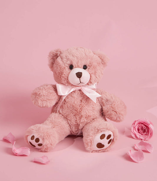 Soft pink teddy bear with a satin bow, a charming add-on to any Basketeer luxury gift basket Bangkok for Valentine's Day. Rose and petals complete this premium hamper delivery Thailand.