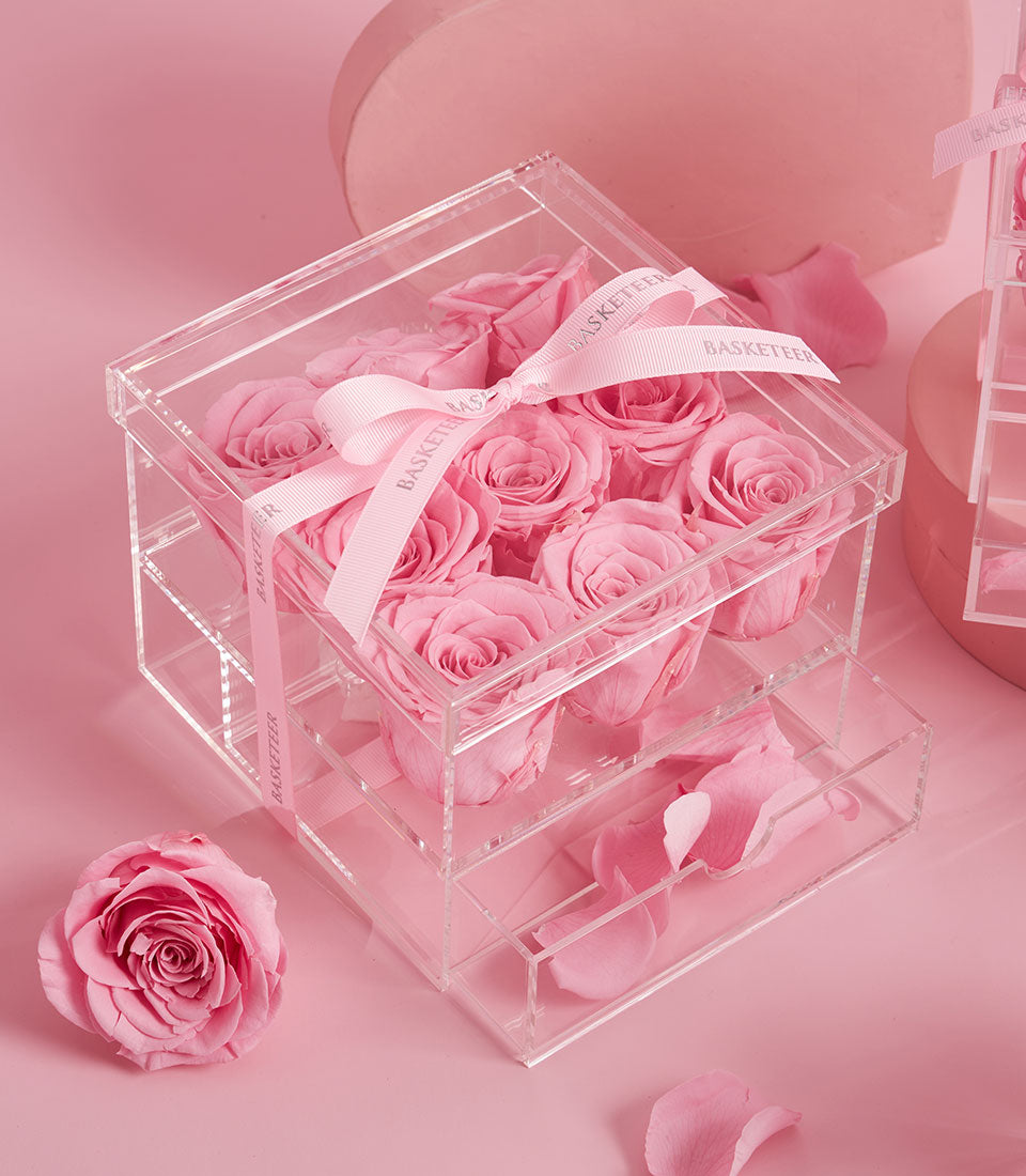 Sweet pink roses from Flowers by Basketeer, preserved in a luxury clear acrylic gift box with delicate ribbon. Perfect premium flowers Bangkok delivery.
