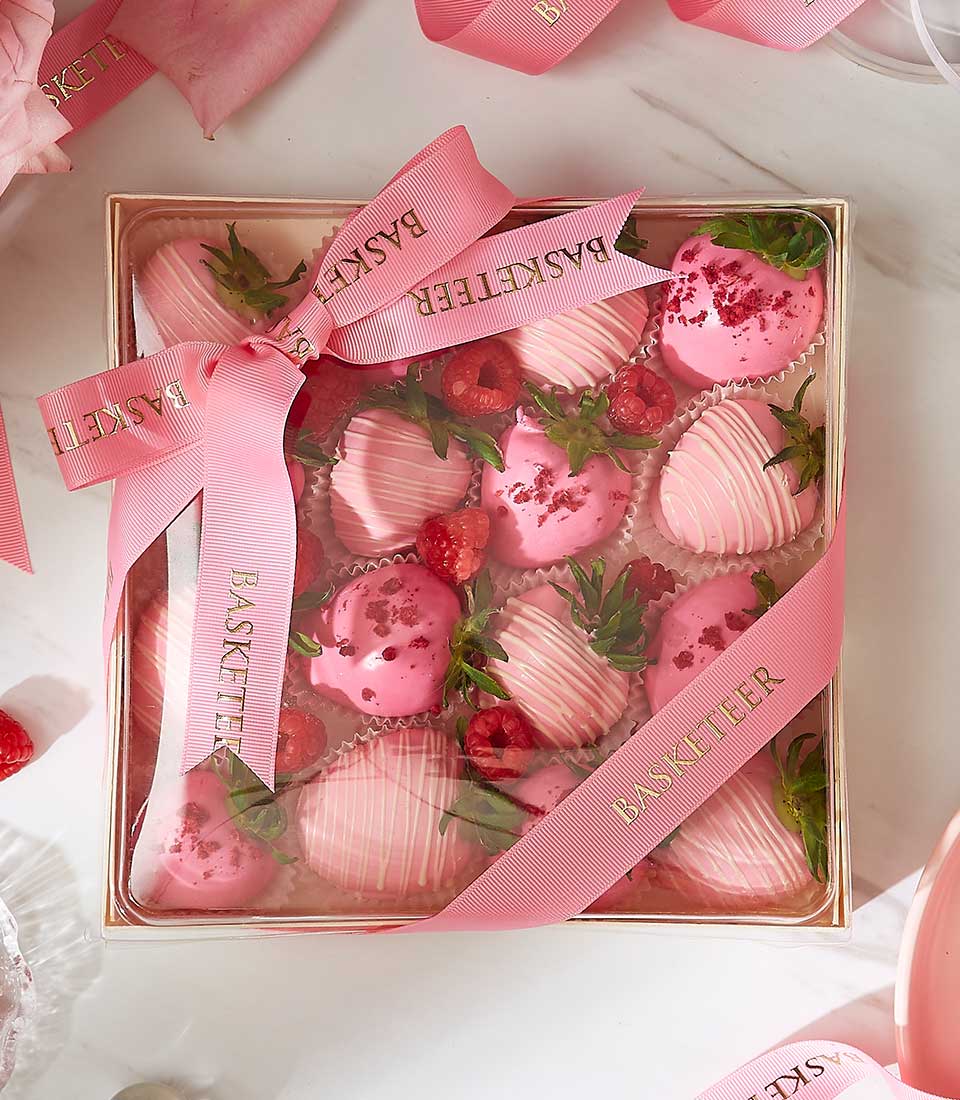 Deluxe pink chocolate-covered strawberries with raspberries in luxury gift box, Valentine's Day