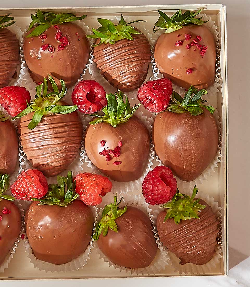 Milk chocolate-covered strawberries and raspberries in luxury gift box, Valentine's Day hamper