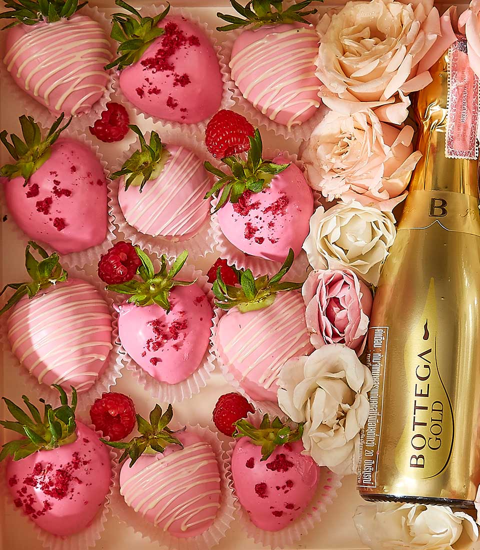 Luxury Valentine gift box with chocolate-dipped strawberries, raspberries, and Bottega Gold sparkling wine with roses