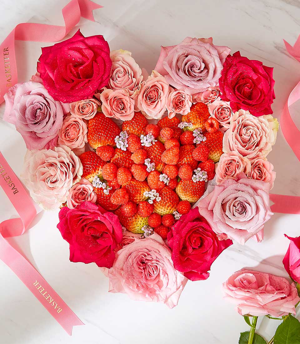 Heart-shaped strawberry and rose arrangement with fresh berries and pink roses in white container