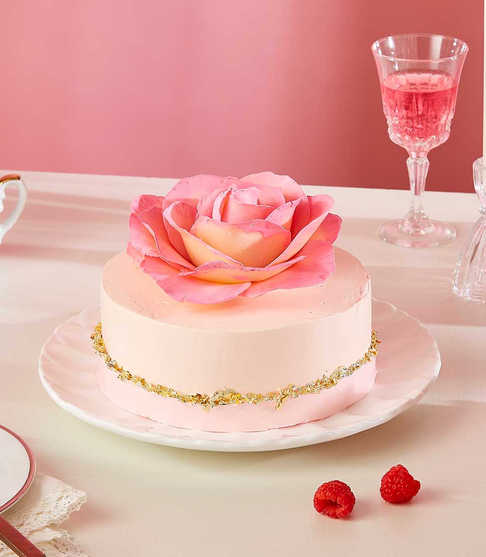 Light pink rose fondant cake with gold leaf trim, Valentine's Day celebration cake on scalloped stand