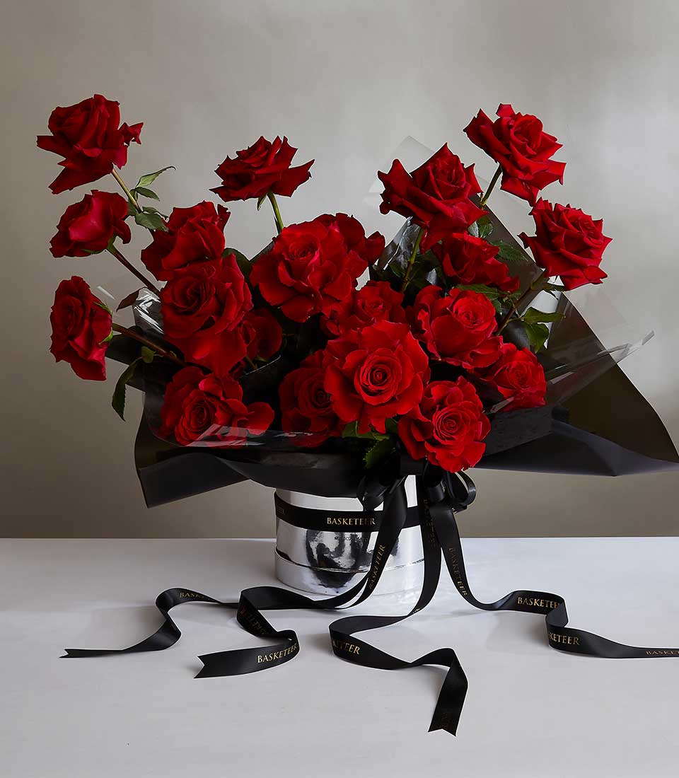 Luxury red roses arrangement in silver hatbox with black satin ribbon, perfect anniversary gift for her