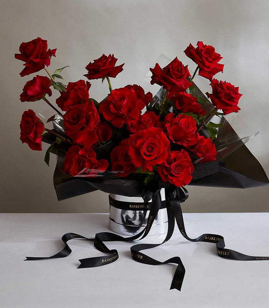 Luxury red roses arrangement in silver hatbox with black satin ribbon, perfect anniversary gift for her
