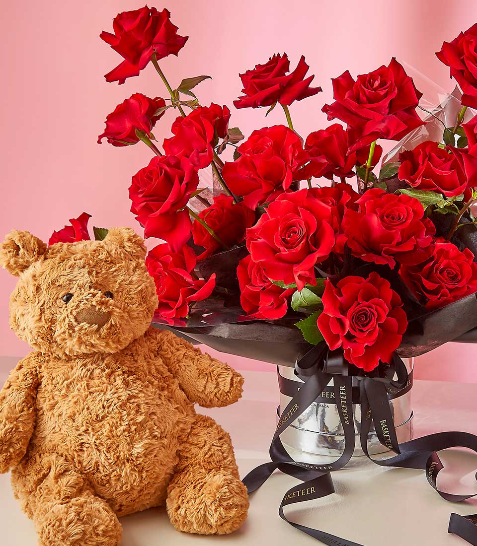 Red roses and teddy bear gift combo in silver vase with black ribbon, perfect for birthday or Valentine's Day