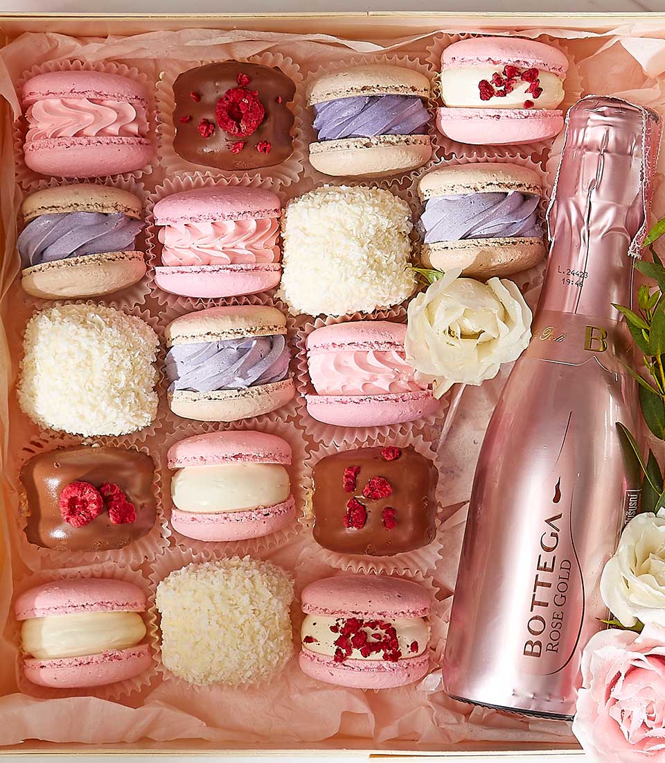 Rose gold macarons and Bottega rosé sparkling wine gift set with fresh roses for Valentine's Day
