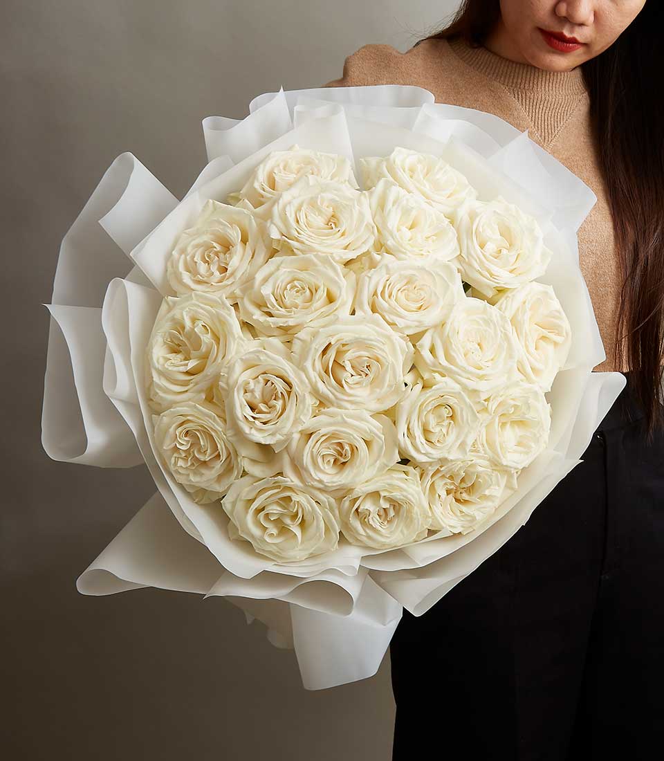 Luxe white roses bouquet with creamy centers, Valentine's Day gift wrapped in elegant white paper
