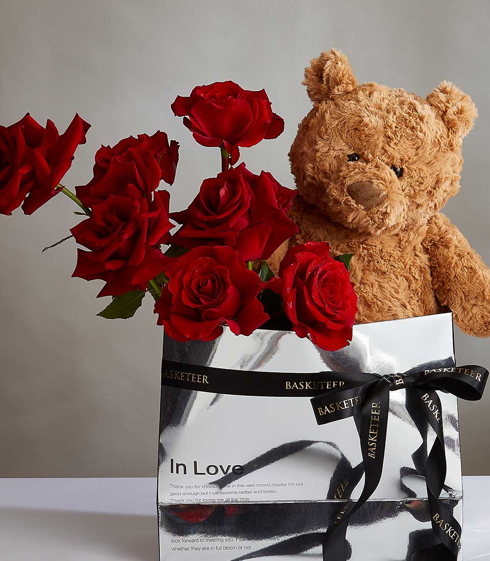 Red rose bouquet with brown teddy bear in silver gift box, premium birthday and romantic gift ensemble