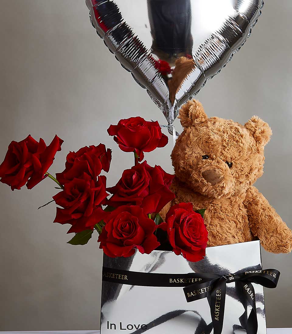 Red rose bouquet with teddy bear and heart balloon in luxury silver gift box for Valentine's Day