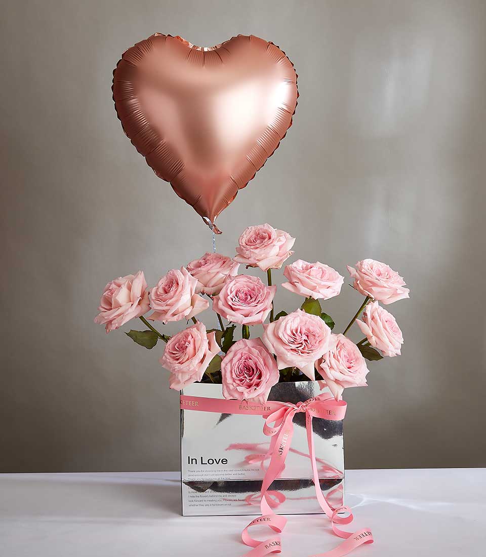 Pink roses with rose gold heart balloon in silver gift box, Valentine's Day surprise