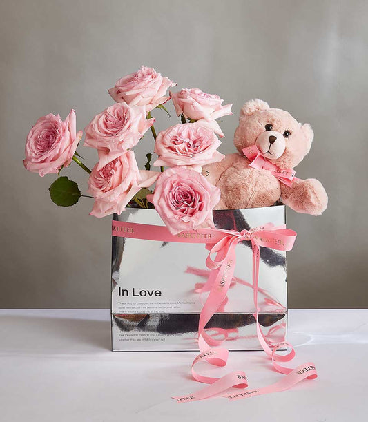 Pink roses and teddy bear gift set in silver box with pink ribbon, perfect for birthdays or romantic occasions