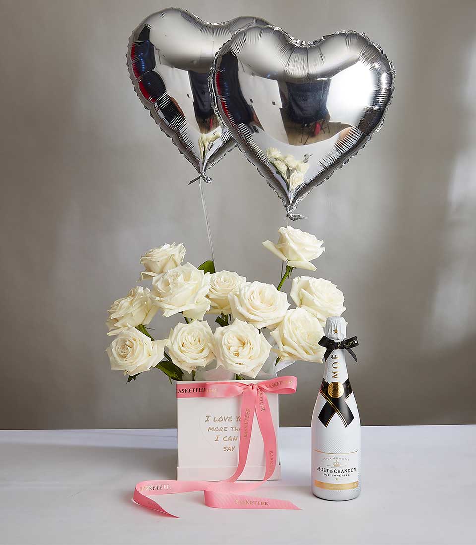 White roses and heart balloons with champagne, anniversary gift set in luxury white box