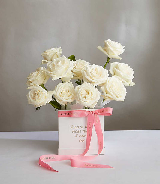 Ivory Bloom white roses in luxury gift box with pink ribbon and gold sentiment message