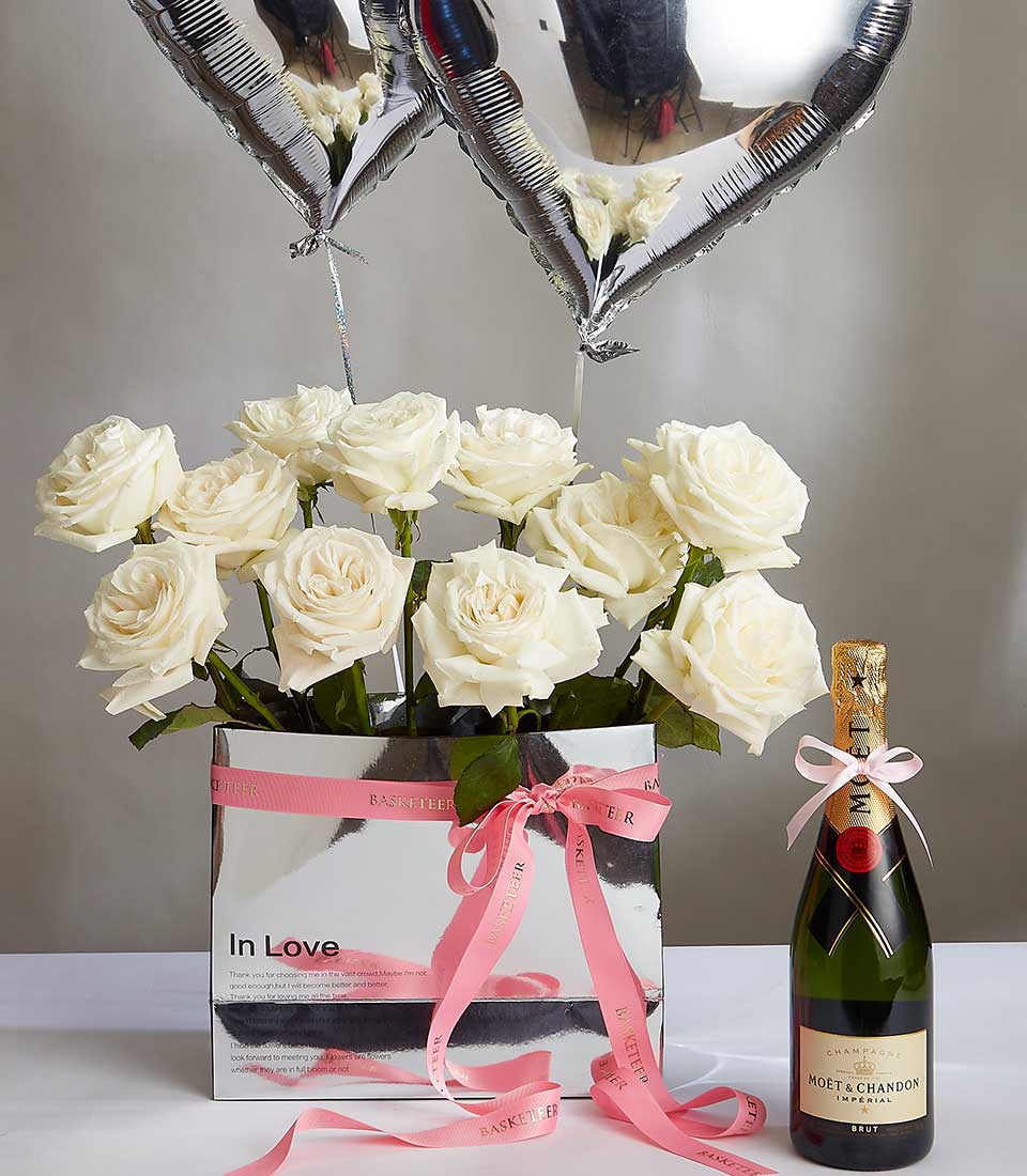 White roses with champagne and heart balloons, anniversary gift set for romantic celebrations
