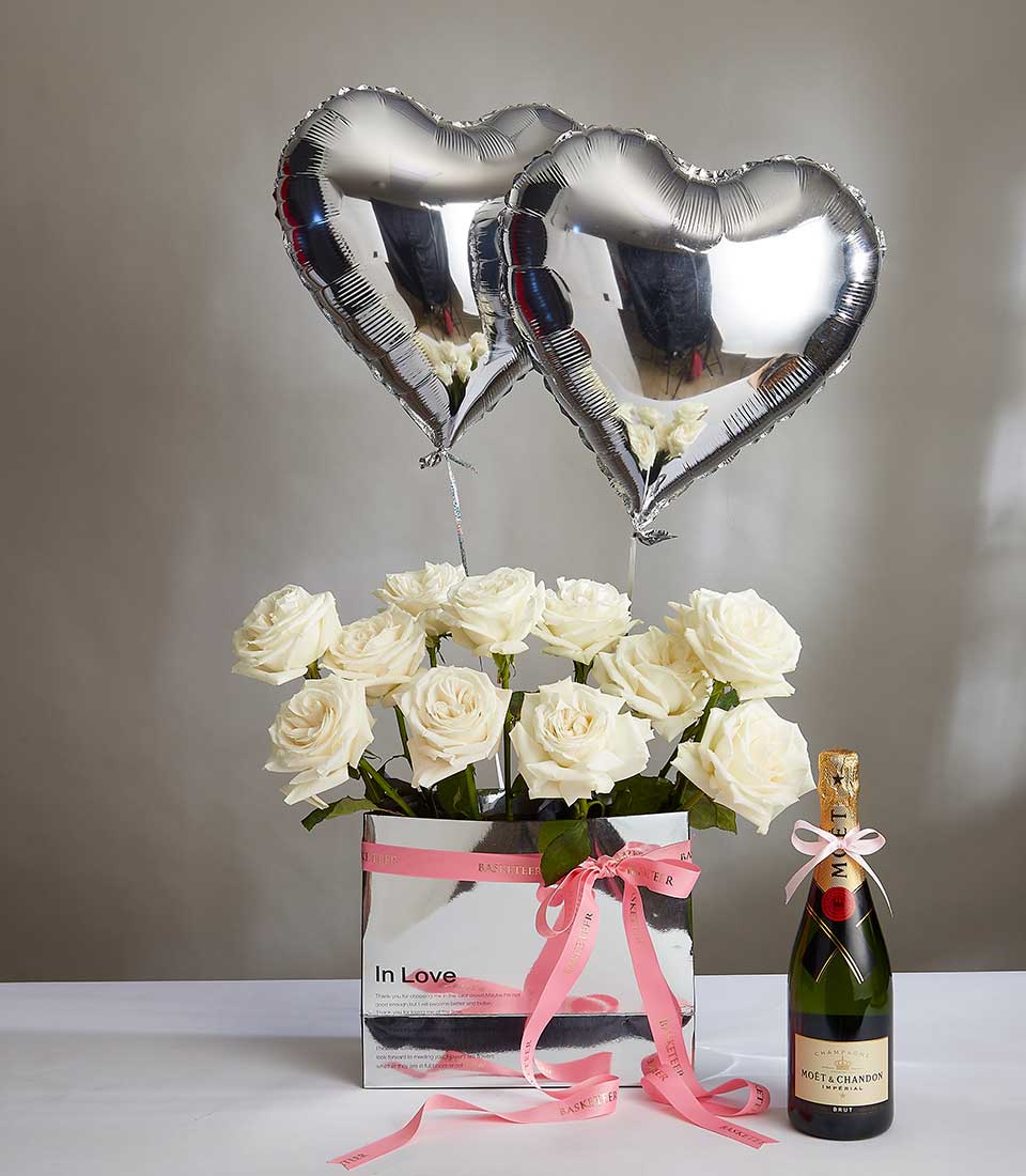 White rose and champagne gift set with silver heart balloons for anniversaries
