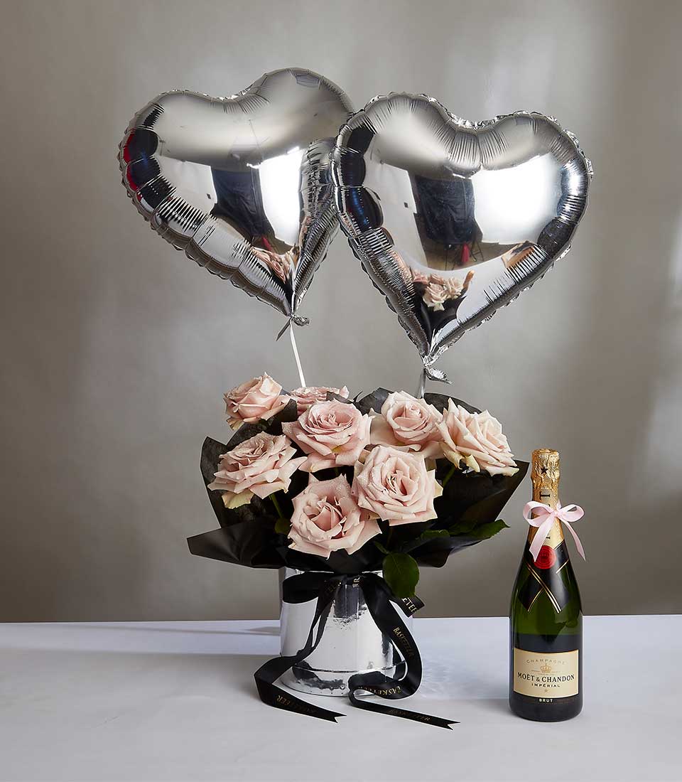 Pink roses in silver vase with champagne and heart balloons, Valentine's Day luxury gift set