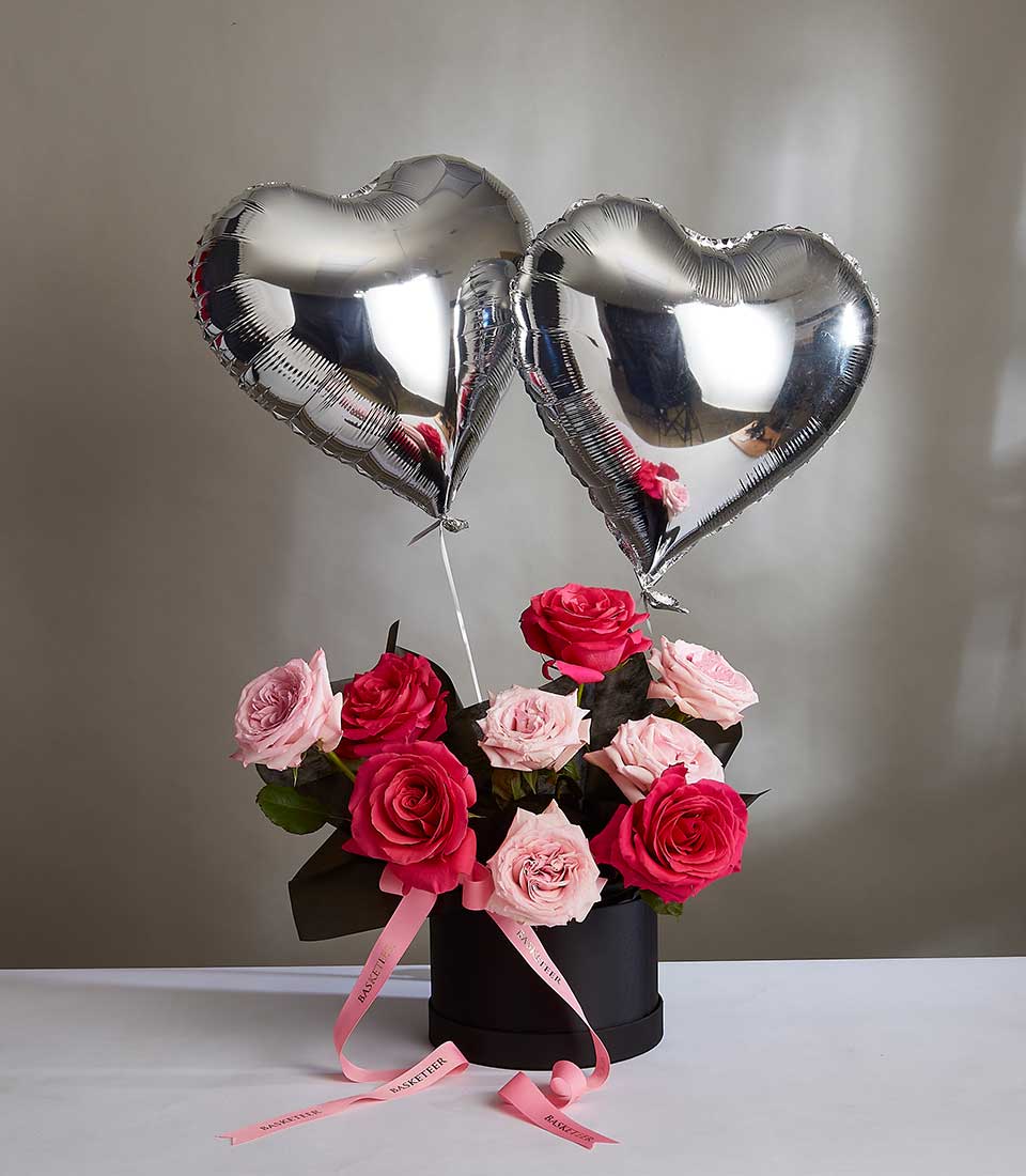 Pink roses midnight surprise gift box with heart balloons for Valentine's Day
