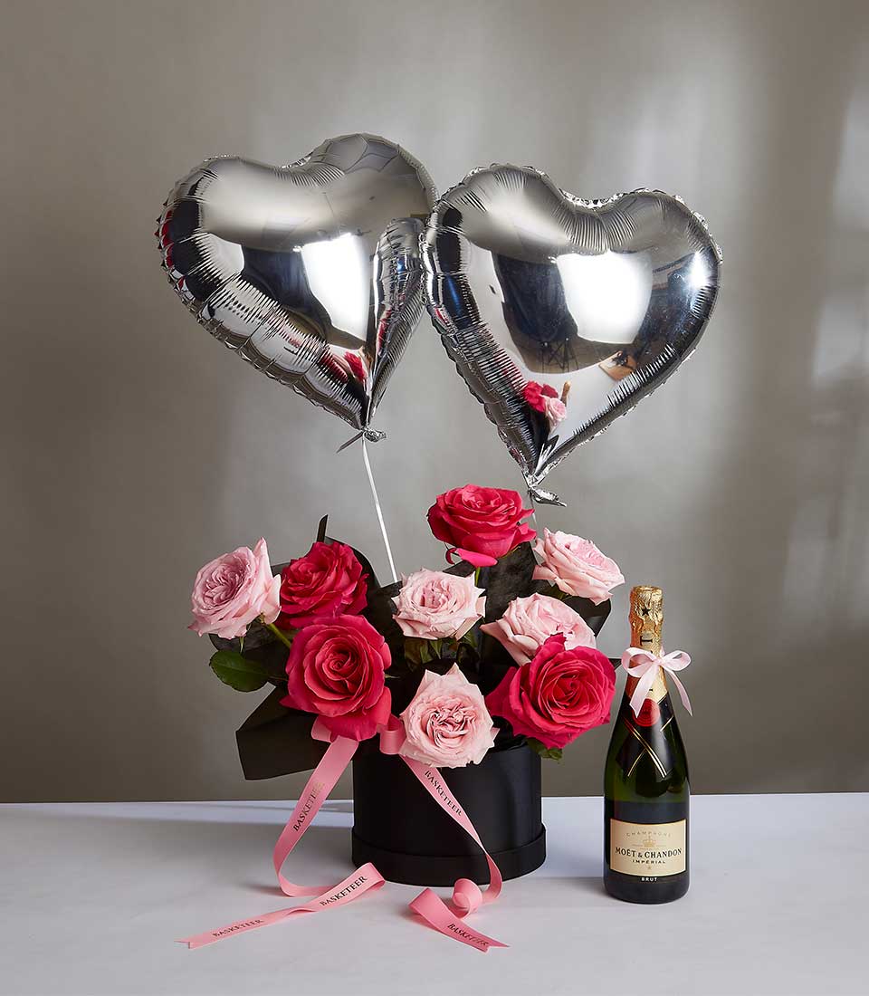 Pink and fuchsia roses with champagne bottle and heart balloons, luxury anniversary gift set