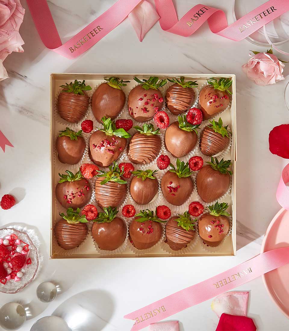 Deluxe milk chocolate-covered strawberries gift box with raspberry drizzle, luxury birthday present