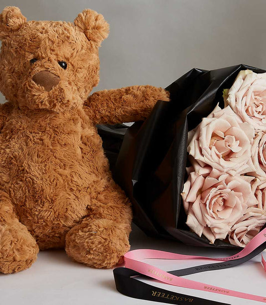 Light pink rose bouquet with teddy bear and black ribbon for Valentine's Day