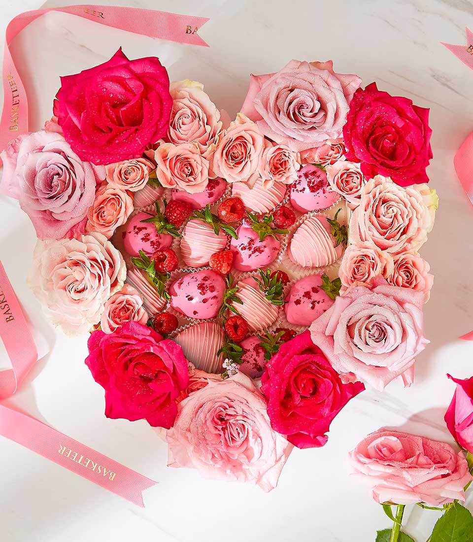 Pink blush heart box with chocolate-covered strawberries, fresh roses, and raspberries