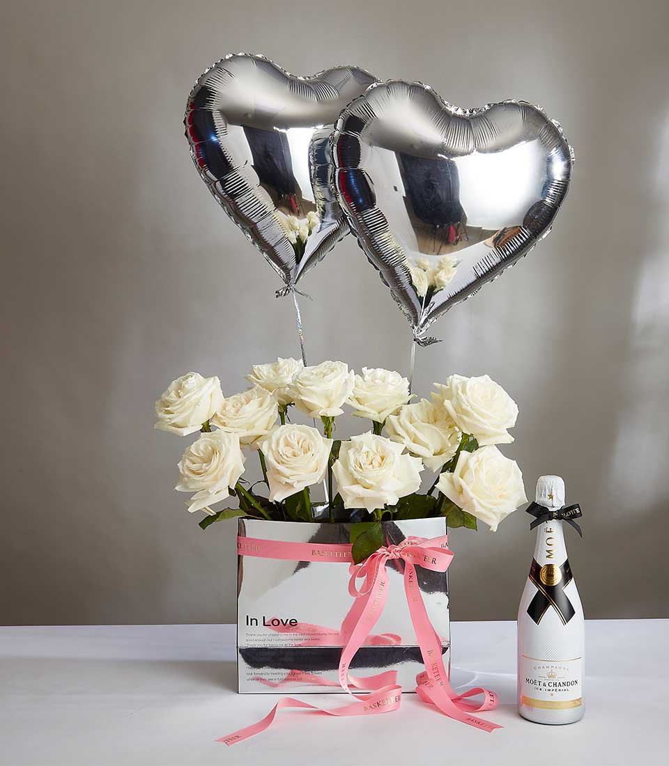 Valentine's champagne and white rose gift set with silver heart balloons and pink ribbon