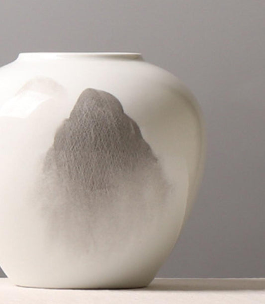 Elegant white ceramic vase from Flowers by Basketeer with a delicate gray mountainscape design, ideal for any flower delivery Bangkok.