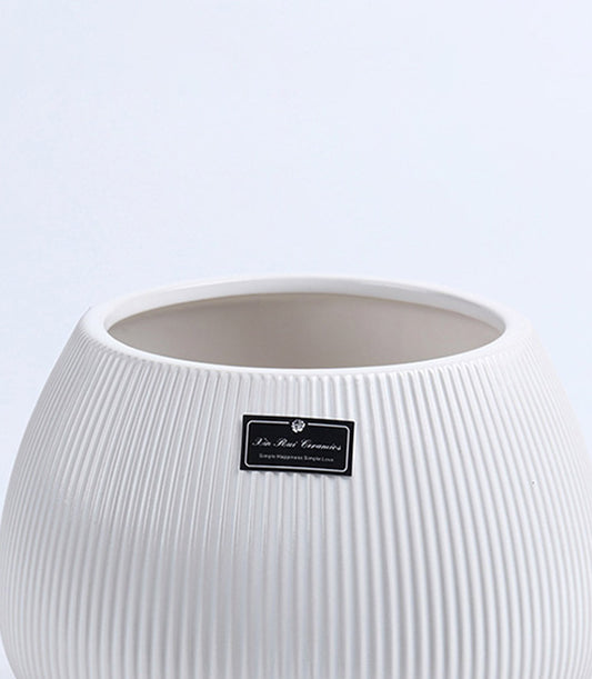White ribbed ceramic vase with rounded body, artisan handcrafted vessel for fresh flowers and home décor