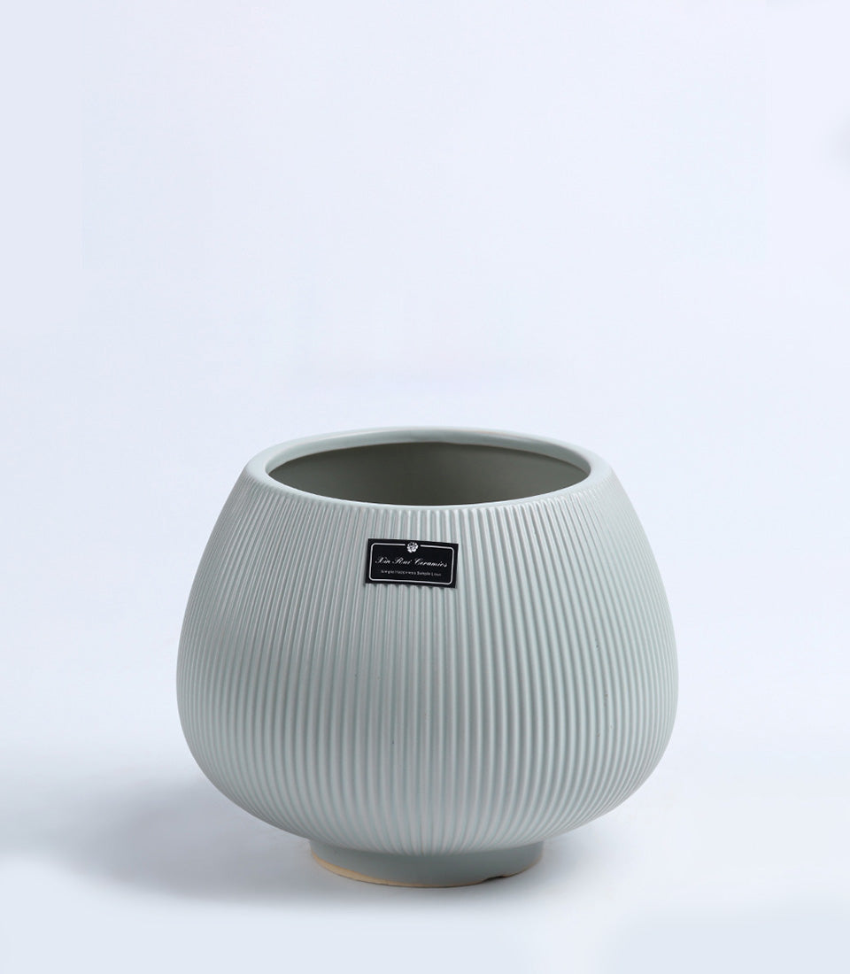 Light grey ceramic vase with ribbed texture and rounded bulbous form, perfect for fresh flowers or home décor gifting