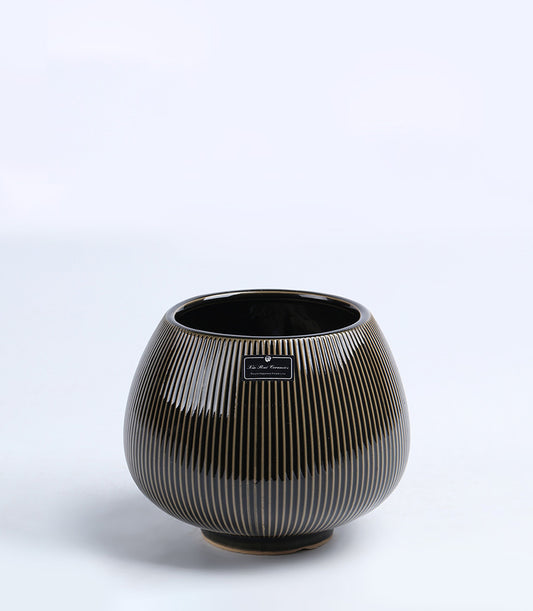 Black ceramic vase with gold striping, glossy finish, rounded bulbous shape perfect for floral arrangements or home decor