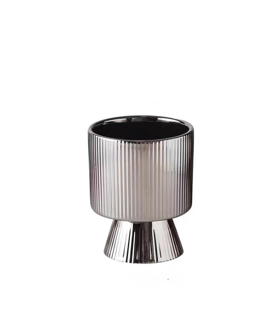 Silver textured ceramic vase with vertical ridging and flared base