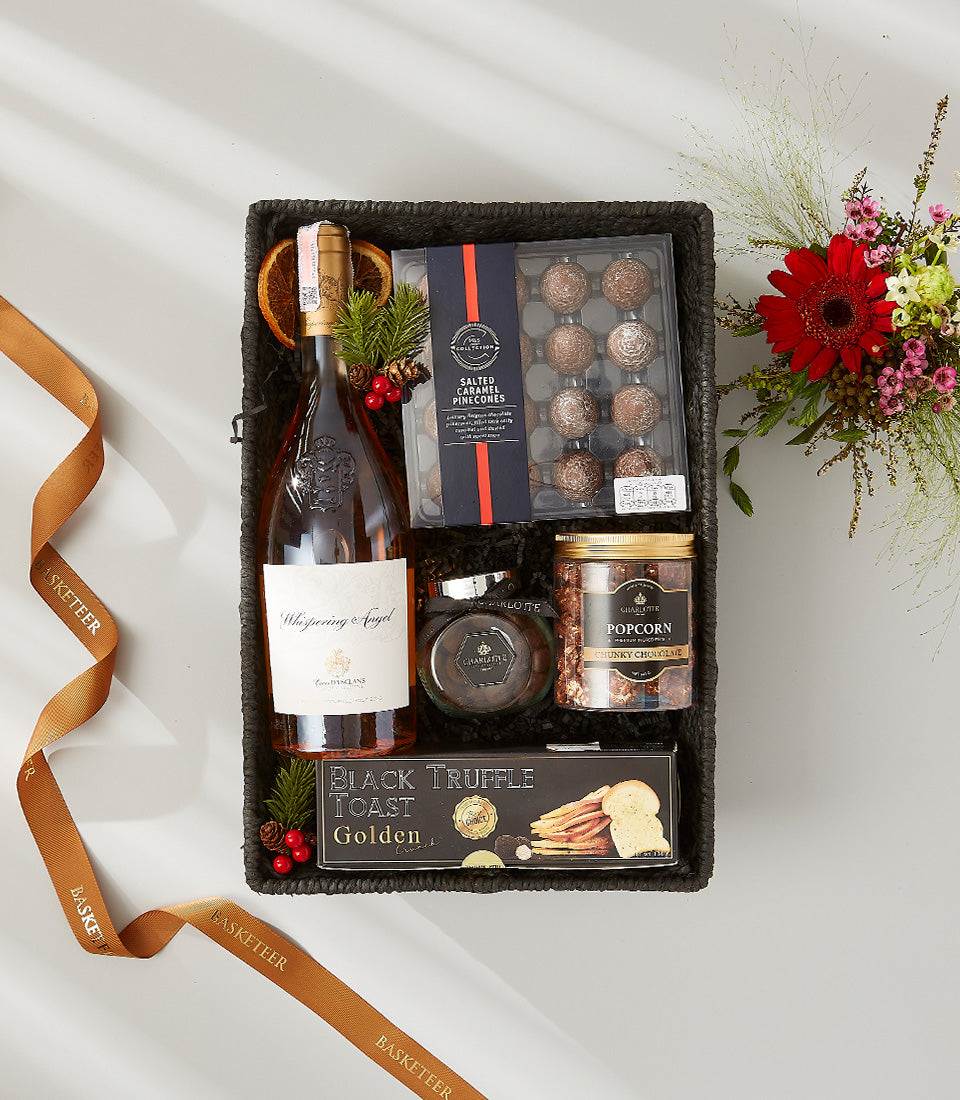 Whispering Angel rosé wine hamper with gourmet chocolates, truffle toast, and fresh flower arrangement