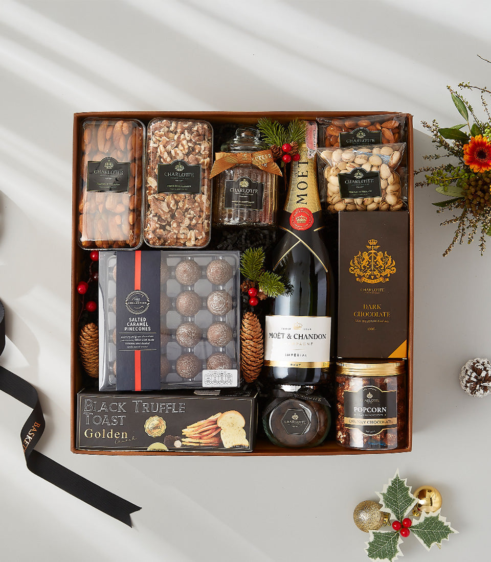 Moët & Chandon champagne luxury gift hamper with artisan nuts, chocolates, and gourmet crackers in wooden box