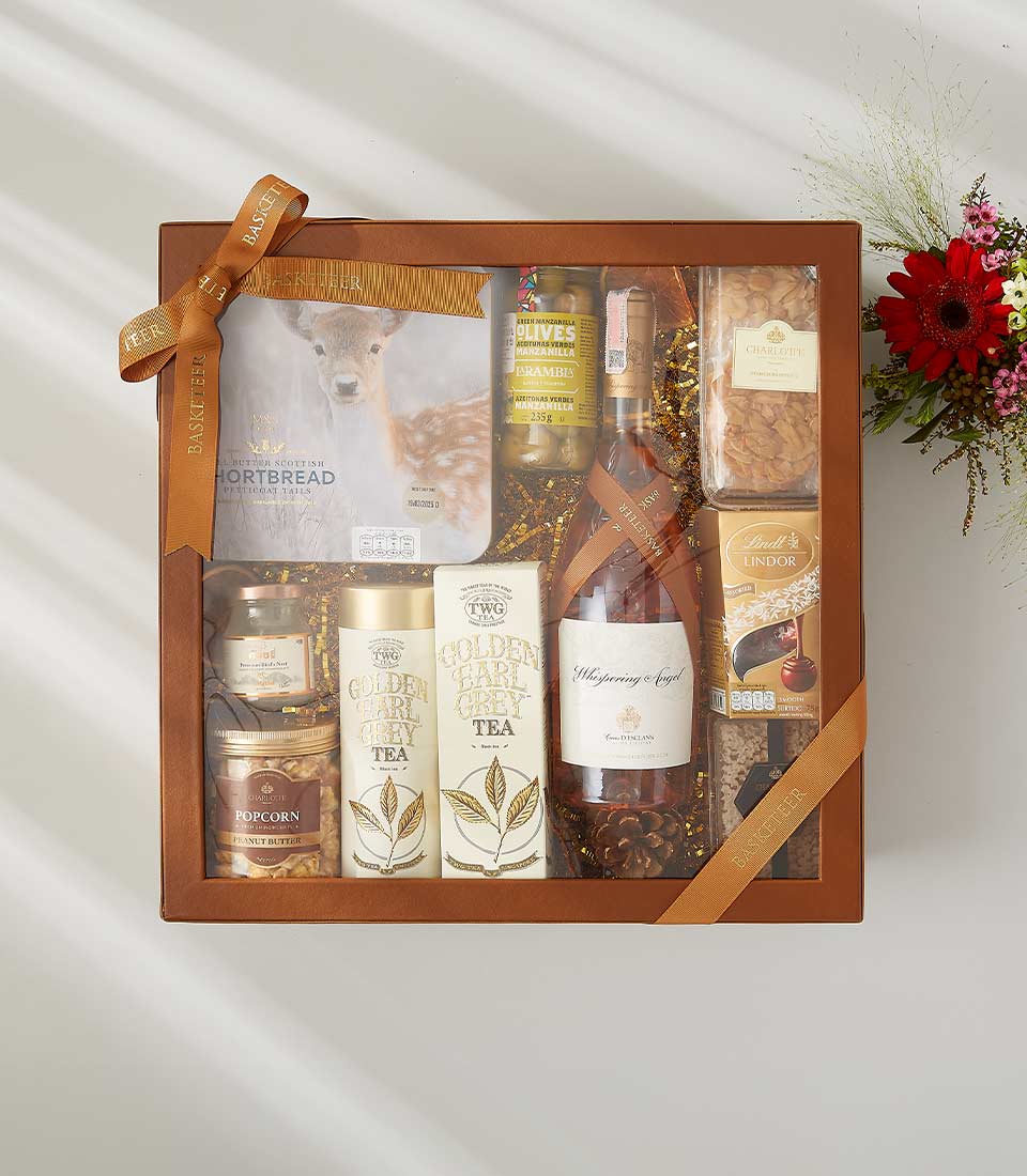 Luxury rosé wine gift box with gourmet treats, Scottish shortbread, earl grey tea, and chocolates