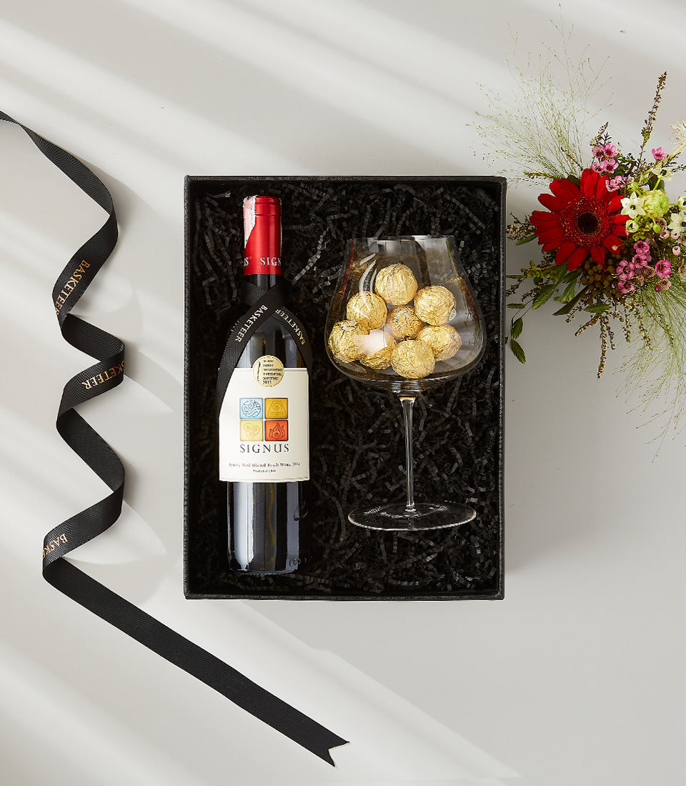 Premium red wine and gold-wrapped chocolates gift set with fresh flower bouquet in luxury presentation box