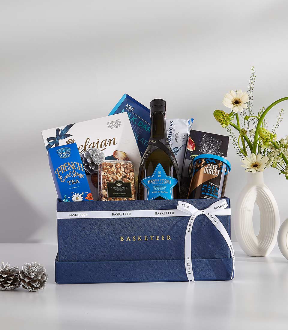 Midnight Snack Attack luxury gift basket with red wine, gourmet chocolates, coffee, and fresh white daisies