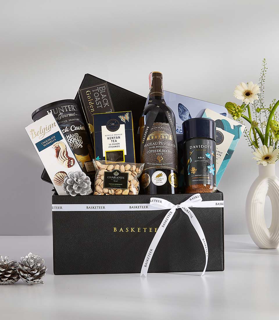 Luxury red wine gift basket with Château Peychaud, gourmet coffee, tea, pistachios, and Belgian chocolates
