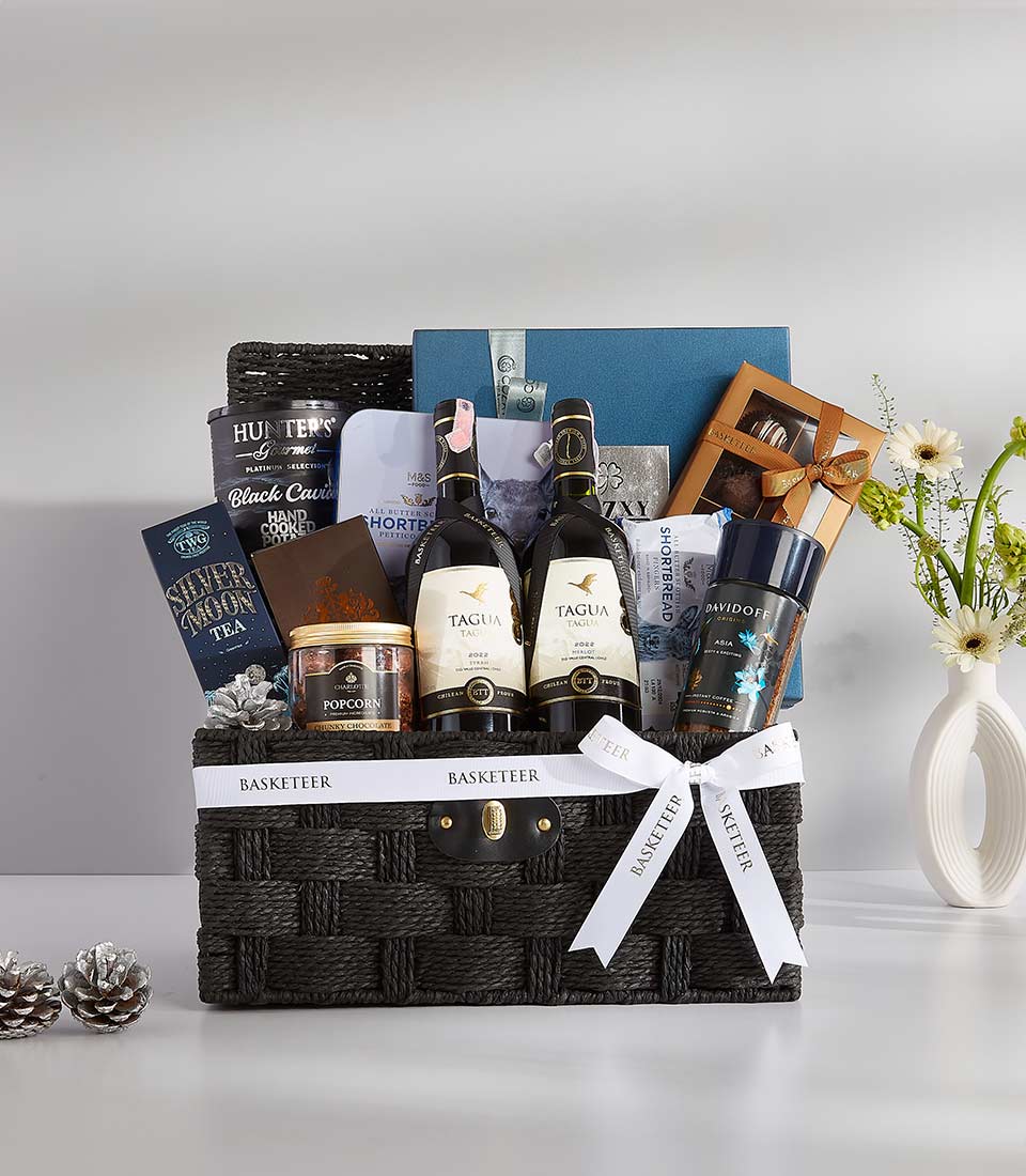 Luxury black woven gift basket with Tagua red wines, gourmet treats, and premium tea