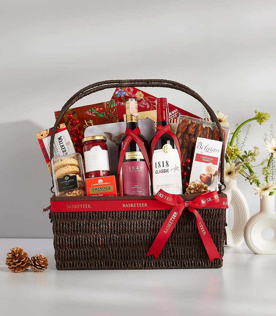 Premium dark brown wicker wine gift basket with red and white wines, gourmet chocolates, and artisan treats