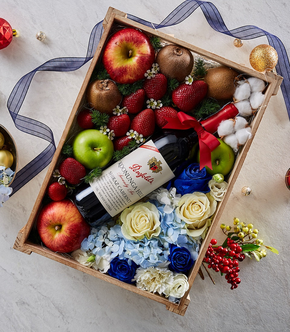Penfolds red wine gift box with fresh fruit, roses, hydrangeas, and seasonal florals in wooden crate