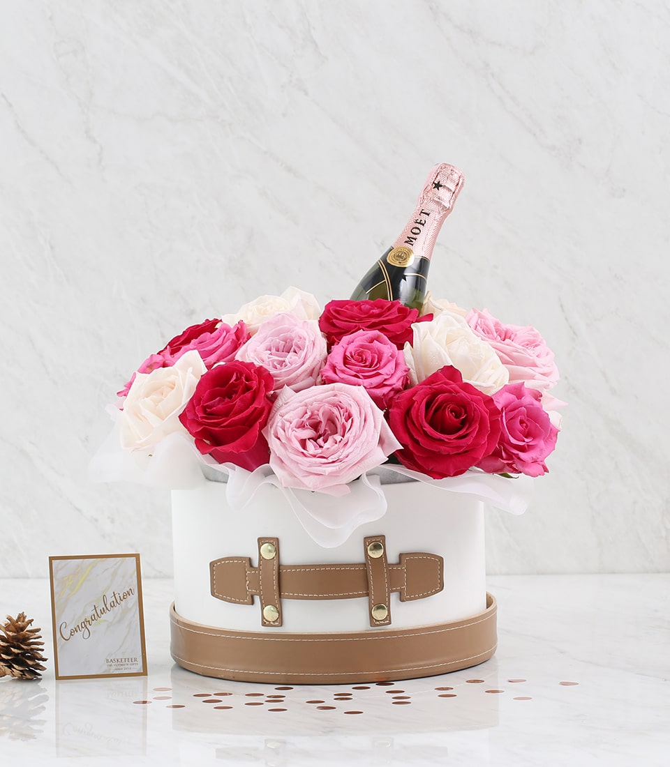Moët Rosé champagne with pink and red roses in luxury gift box, perfect for anniversaries
