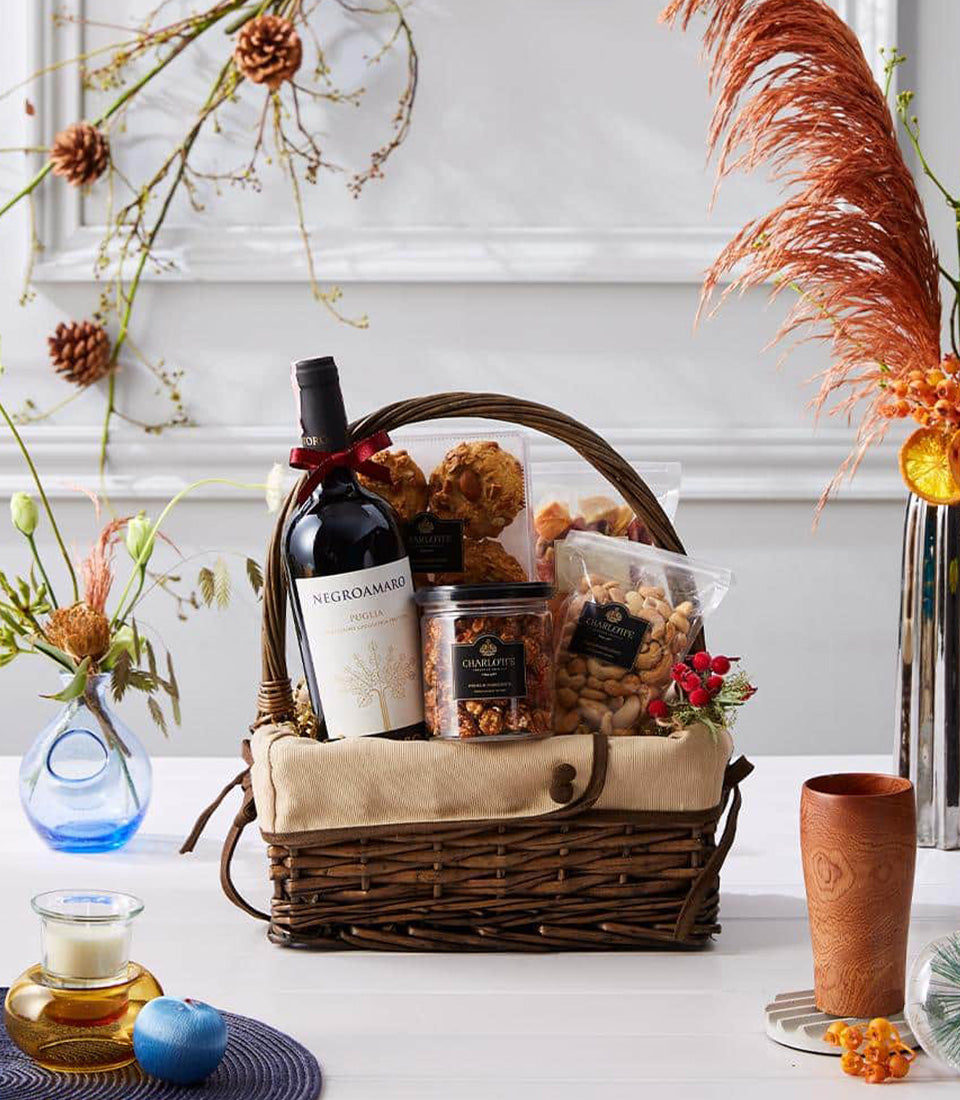Premium wine and gourmet snacks gift basket with Negroamaro red wine, caramel popcorn, and cashews