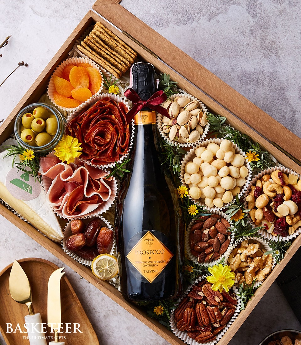 Prosecco and gourmet nuts charcuterie gift hamper with cured meats, cheese, and crackers in wooden box