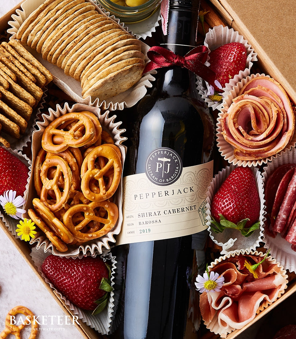 Pepperjack Shiraz gift box with charcuterie, crackers, pretzels, strawberries and cured meats