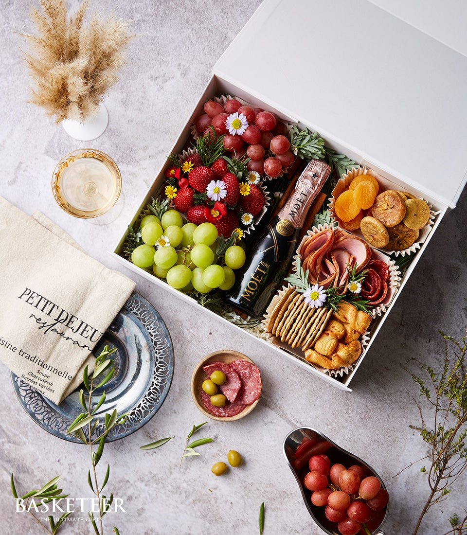 Moët Rosé mini champagne with fresh fruit, charcuterie, and crackers in premium gift box
