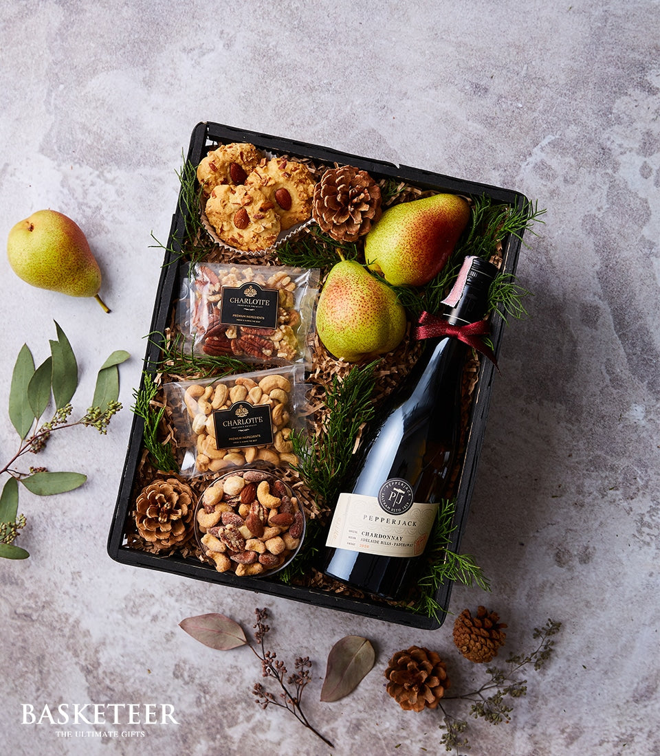 Premium wine gift hamper with Pepperjack Chardonnay, pears, mixed nuts, and artisan cookies