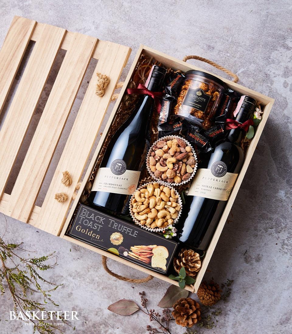 Premium wine and gourmet gift box with Chardonnay, Shiraz Cabernet, artisan chocolates, truffle toast, and roasted nuts