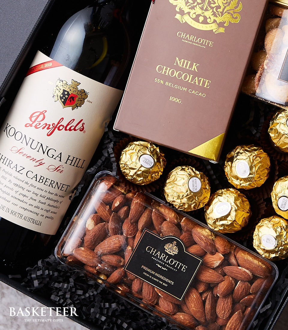 Premium red wine gift box with gourmet chocolates and almonds